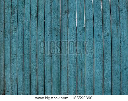 Background from a wooden fence of blue color