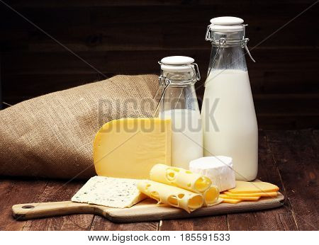 Milk Products - Tasty Healthy Dairy Products And Milk Jar, Glass Bottle And Cheese Platter