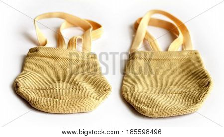 Rhythmic gymnastics shoes worn on white background.