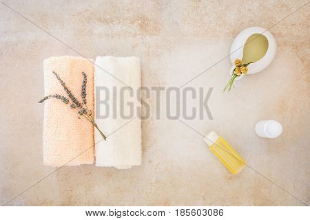 Lavender and helichrysum essential oil, spa treatment. Top view, rustic surface, blank space
