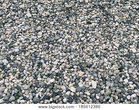 mobile photo grey peble on beach textured background
