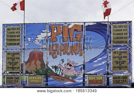 Cornwall, Quebec - July 26, 2014 - Close up of a colorful descriptive billboard sign at the Ribfest in Cornwall, Ontario on a sunny afternoon in July.