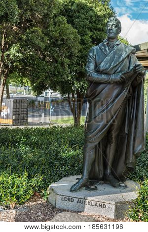 Auckland New Zealand - March 4 2017: Bronze statue of standing Lord Auckland set in green vegetation on Aotea Square.