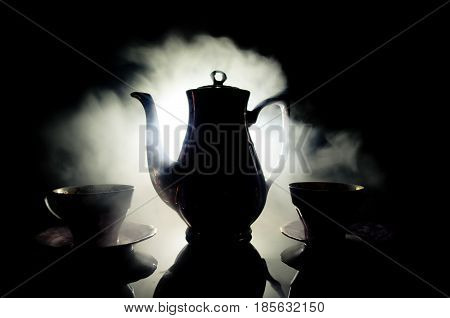 Food Background Tea And Coffee Theme. Old Vintage Ceramic Tea Or Coffee Pot With Cups Jug And Sugar