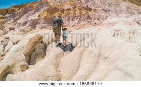  Little girl on a weekend hike with her dad in Paint Mines Interpretive Park in Colorado.