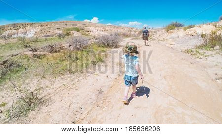   Little girl on a weekend hike with her dad in Paint Mines Interpretive Park in Colorado.