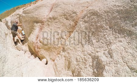   Little girl on a weekend hike with her dad in Paint Mines Interpretive Park in Colorado.
