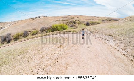 POV point of view - Little girl on a weekend hike in Paint Mines Interpretive Park in Colorado.