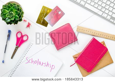 scolarship apply with credit cards and wallet on white table background top view