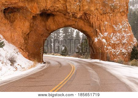 Snow falls at the tunnel on highway 12 heading through Red Canyon