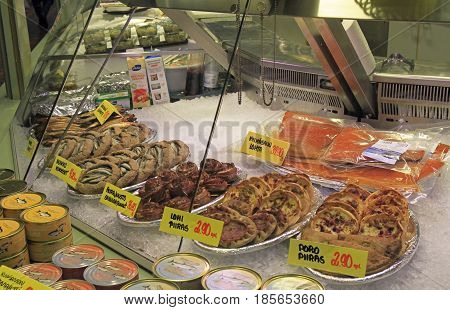 Oulu, Finland - April 11, 2017: stall with small pies and fish at market in Oulu, Finland