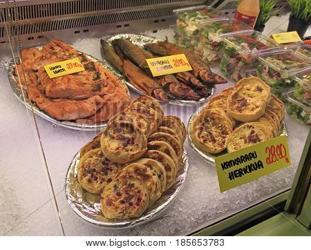 Oulu, Finland - April 11, 2017: stall with small pies and fish at market in Oulu, Finland