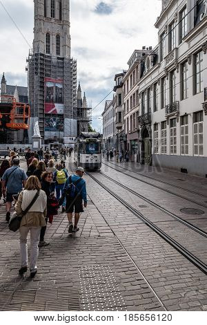 Ghent Belgium - July 31 2016: Cityscape of Ghent with tram and a crowd of tourists
