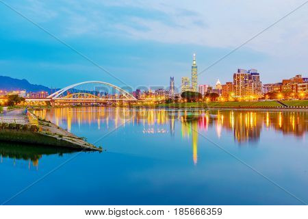 View of Keelung river and Taipei city buildings in the evening