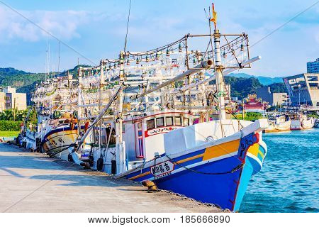 KEELUNG TAIWAN - APRIL 04: View of large fishing boats in Badouzi fishing village in the countryside of Keelung on April 04 2017 in Keelung