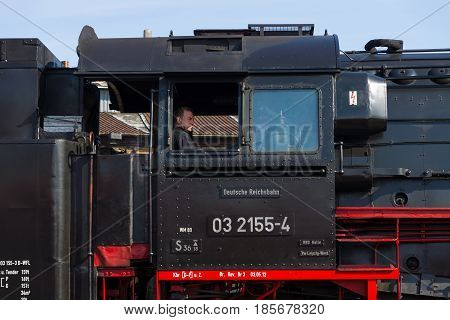 BERLIN - APRIL 21: The driver of the locomotive. Spring Festival Exhibition in the Rail yard Schoeneweide April 21 2013 in Berlin Germany