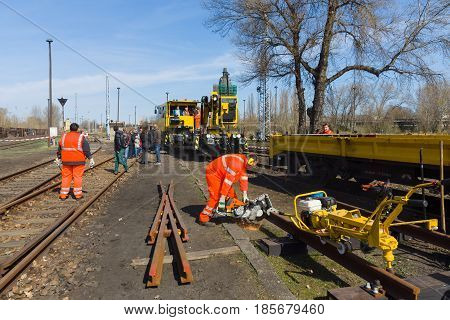BERLIN - APRIL 21: Working Deutsche Bahn demonstrates working with cutting machine. Spring Festival Exhibition in the Rail yard Schoeneweide April 21 2013 in Berlin Germany