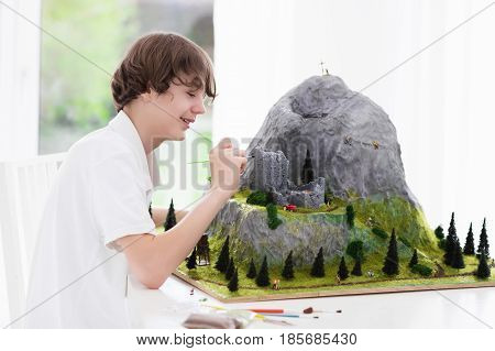 School Student Working On Model Building Project