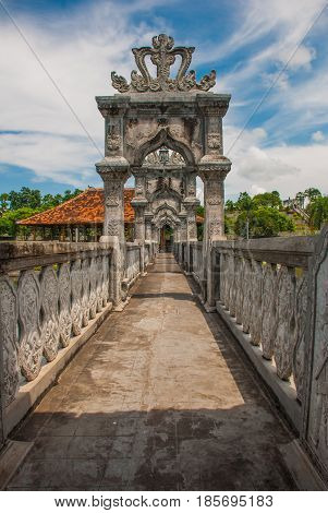 The bridge over the pond. Architectural wonders at the Karangasem water temple in Bali, Indonesia.