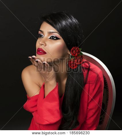 young attractive brunette posing make-up in red shirt