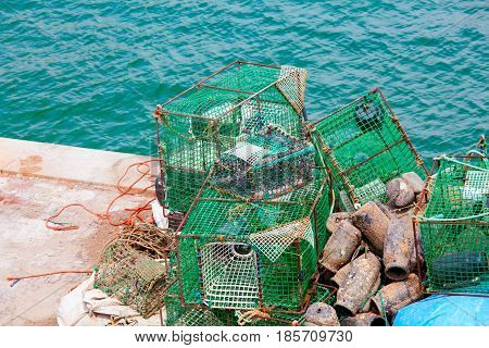 Lobster pots and crab pots drying in the sun on the pier