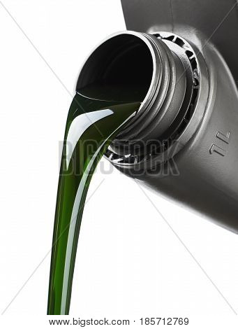 The oil for the engine flows the open plastic canister the green motor grease with molygen