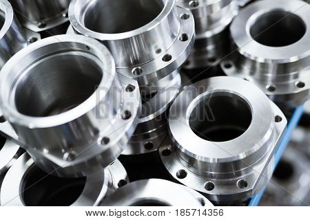 Close-up of a set of metallic gears and parts produced in metal factory