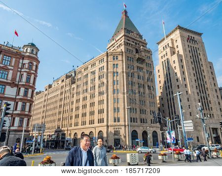 Shanghai, China - Nov 4, 2016: View of Former Palace (South Wing of the Peace) Hotel, Sassoon House and Bank of China buildings (left to right) along The Bund on Zhongshan East 1st Road.