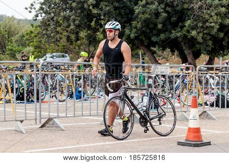 Nahariyya Israel - May 06 2017 : Participant of the annual triathlon starts from the start in the competition in cycling in Ahziv near the town of Nahariya