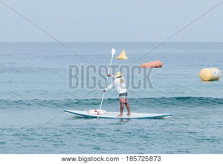 Nahariyya Israel - May 06 2017 : Rescuer on the lifeboat watches the participants of the annual triathlon which participate in a swim in the Mediterranean Sea in Ahziv near the town of Nahariya