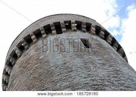 Fortress tower in grey hardstone seen from below