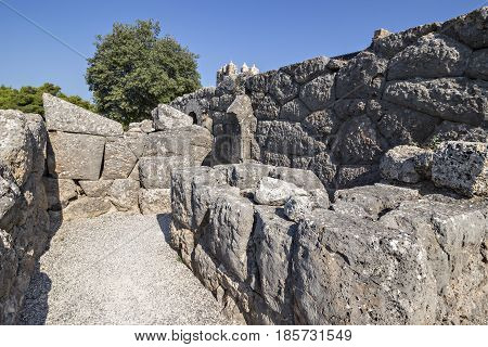 Stone walls in the entrance to an antique temple Necromanteion, Epirus, Greece.  Door to Hades, the realm of the dead, on the banks of the Acheron river
