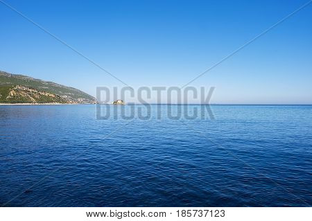 View of the sea and rocks in the Portinho da Arrabida beach in Setubal Portugal