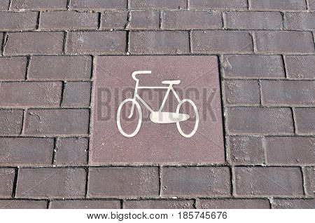Bicycle lane signage on street. Bicycle sign path on road bikes' lane on outskirts or urban area.