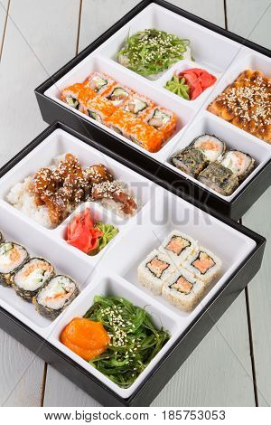 Bento lunch boxes served on wooden table