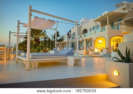 SANTORINI, GREECE - CIRCA AUGUST, 2015: view of Andromeda Villas in the evening. Andromeda Villas is a hotel are situated in Imerovigli, Santorini island.