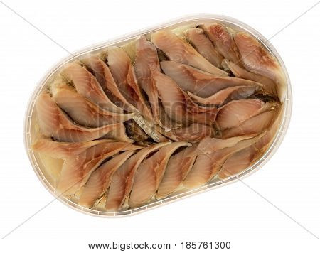Pieces of herring in oil. Herring marinated tinned.