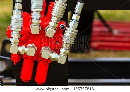 Agriculture equipment concept. Industrial detailed pneumatic hydraulic machinery made of steel closeup