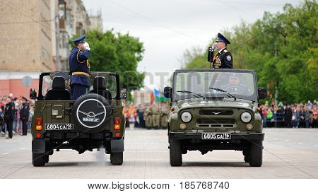 Orel Russia - May 9 2017: Celebration of 72th anniversary of the Victory Day (WWII). Military generals saluting in open cars on empty square before parade horizontal