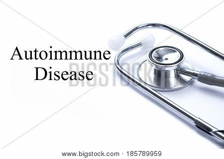 Page with Autoimmune Disease on the table with stethoscope medical concept.