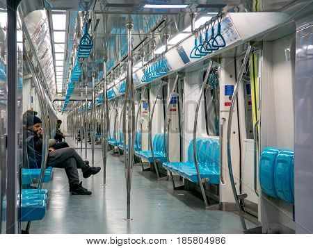 Istanbul, Turkey - February 21, 2017: People in a train of istanbul Metro. The Istanbul Metropolitan is serving over 500 million passengers per year.