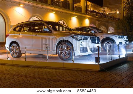 Sochi, Russia - October 12, 2016: New Luxury Bmw x4 and x6 at night new model of the brand BMW near the dealers showroom.