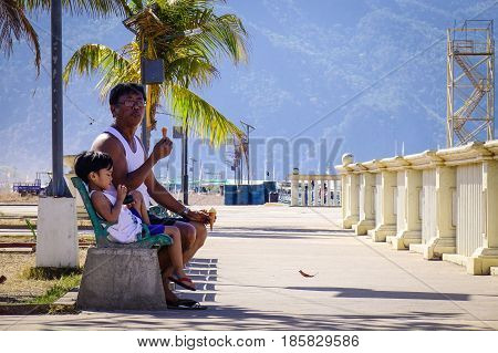 People Sitting At Seaside Park