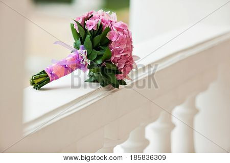 Beautiful blossoming pink hydrangea and orchids in weddin bouquet.