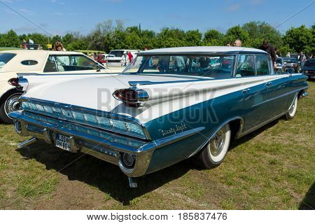 PAAREN IM GLIEN GERMANY - MAY 19: Full-size automobile Oldsmobile 98 (Ninety-Eight) rear view The oldtimer show in MAFZ May 19 2013 in Paaren im Glien Germany