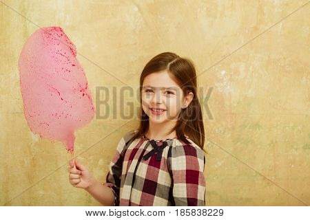 Happy Pretty Girl Smiling With Cotton Candy On Stick