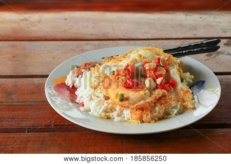 Fried rice with fried egg on table