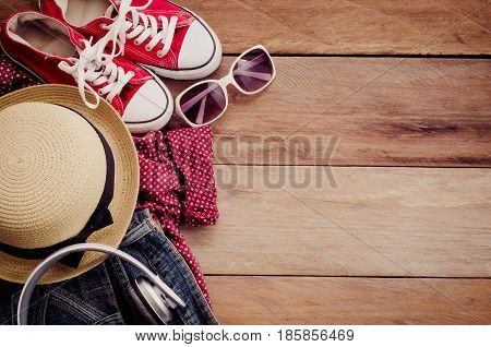 Clothing and accessories for women on wood floor