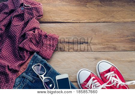 Clothing and accessories for women on wood floor
