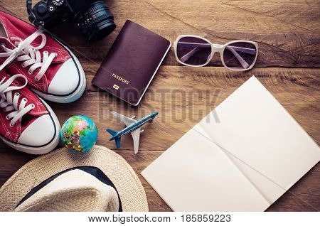 Planning for trip clothing and accessories on wood floo